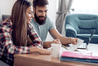 A man and woman go over their finances together.