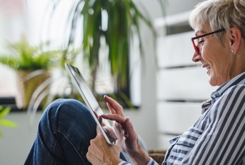senior woman using digital tablet