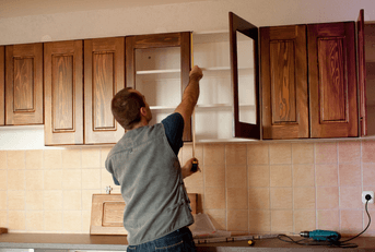 Carpenter working on new kitchen cabinets
