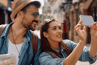 tourist couple taking photo