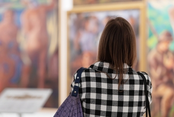 Woman visiting excursion in museum