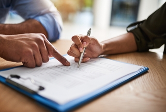 HR manager signing a contract