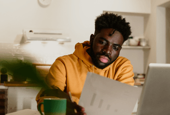 person banking on laptop