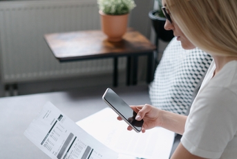 Woman scanning utility bill