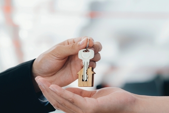 Real estate agent holding key