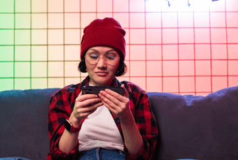 person playing game app on phone