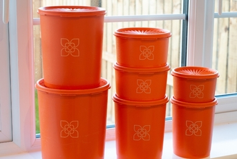 orange vintage Tupperware kitchen storage bins