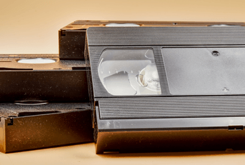 Vintage videotapes on beige background