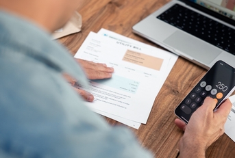 man using a smartphone calculator
