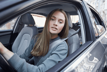 young driver backing car up