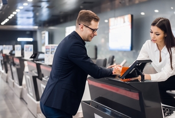businessman in suit holding his passport