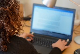 woman working on laptop from home