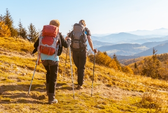 elderly people with large backpacks
