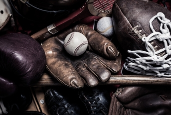 group of assorted vintage antique sports equipment