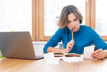 shocked woman sitting at the table