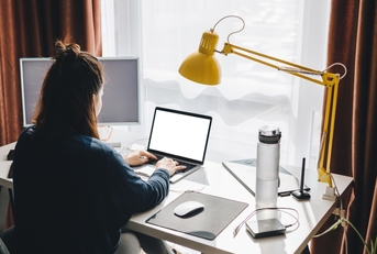 woman working on laptop at home