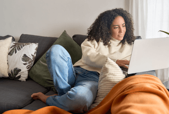 person on computer at home