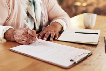  senior woman with application for retirement