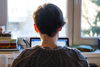 back of young caucasian entrepreneur woman