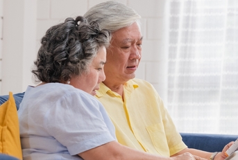 senior couple use tablet searching prescription