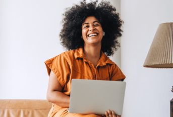 smiling person on laptop