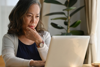 woman work at home using notebook computer