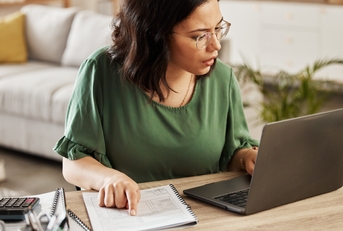 woman with laptop doing analysis