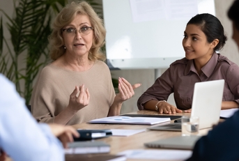 businesswoman with indian ethnic partner at meeting