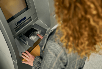 person using ATM
