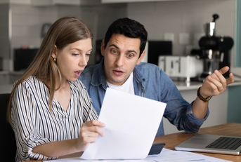 couple analyzing financial documents