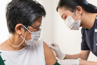 senior woman getting vaccinated