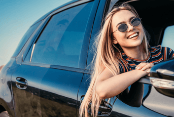 person leaning out car window