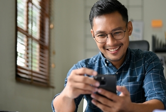 Smiling man looking at home