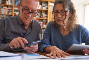 senior couple managing bills