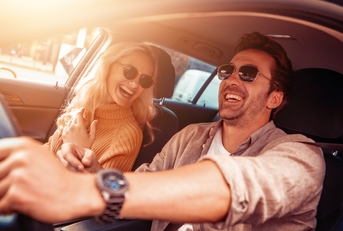happy couple in car