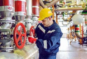 plant worker in protective suit