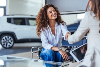Happy woman buying a car