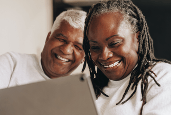 retired couple on tablet