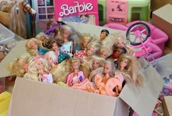 Barbie dolls packed in a cardboard box