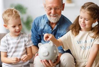 grandfather helping grandchildren 