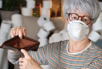 senior woman holding empty wallet