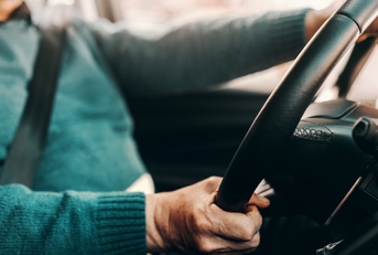 senior man driving his car