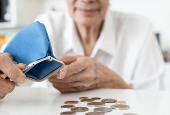 senior woman with her coins