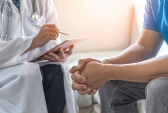 Men's health exam with doctor