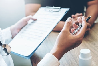 doctor and patient sit and talk
