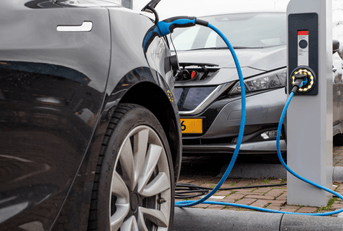 Electric vehicles are being charged at a charging station.