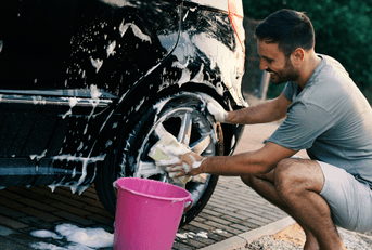 person washing car