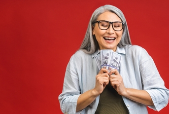 old woman holding money