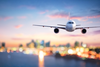 airplane in flight at twilight