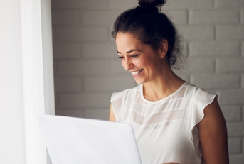 businesswoman holding a laptop